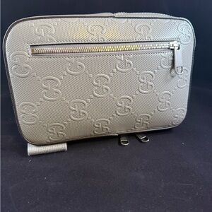 Gray GUCCI crossbody bag/pouch.